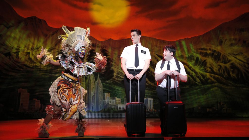 The Book of Mormon Kelechi Ezie (left) greets KJ Hippensteel and Christopher John O'Neill, as two would-be Mormon proselytisers, in 'The Book of Mormon' at the Forrest Theatre