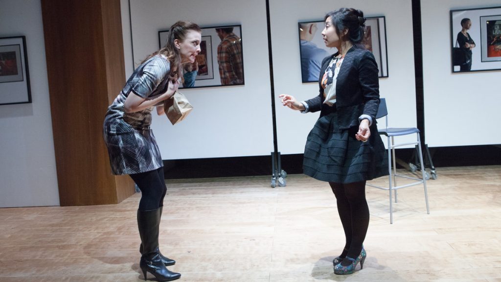  Christie Parker (left) and Bi Jean Ngo in InterAct Theater Company's world premiere of 'Caught.' (Photo courtesy of  Plate 3 Photography) 