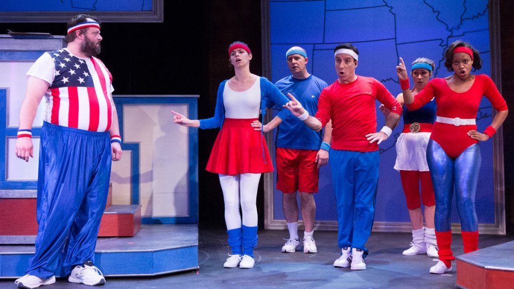 675-69 The cast of 1812 Productions' 'This Is the Week That Is,' cheering for their own political perspectives. From left (left position, not necessarily political perspective): Scott Greer, Tabitha Allen, Don Montrey, Dave Jadico, Susan Riley Stevens and Aimé Donna Kelly. (Photo courtesy of Mark