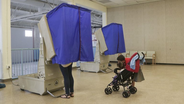 A woman votes at the Salvation Army in Philadelphia's 7th Council District. (Kevin Cook/for WHYY)