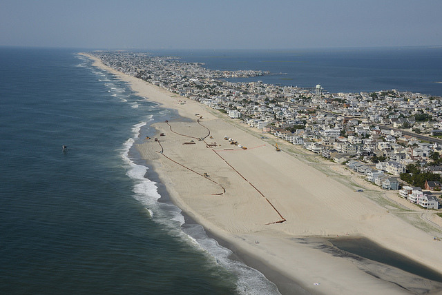 9160424528_281ed55974_z The U.S. Army Corps of Engineers Philadelphia District pumps sand onto Brant Beach, NJ in June 2013. The work is part of an effort to restore the Coastal Storm Risk Management project from damages associated with Hurricane Sandy. (Image: U.S. Army Corps of Engineers)