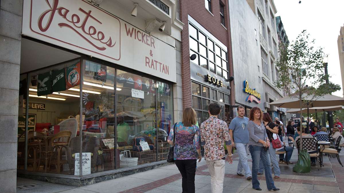Visitors to Allentown wander through the city on the night of the hockey arena opening.(Lindsay Lazarski/WHYY)