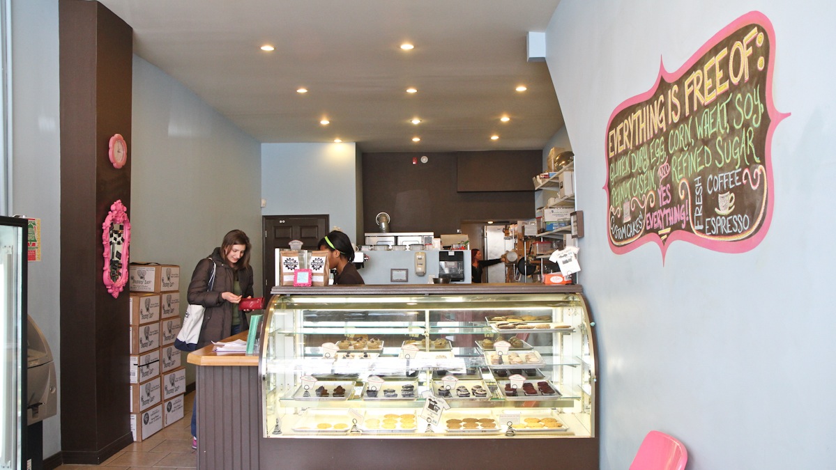  Whitney Martinko, a Center City resident who is gluten and dairy intolerant, buys a treat at Sweet Freedom Bakery at 15th and South Streets. The bakery sells products free of allergens. (Kimberly Paynter/WHYY) 