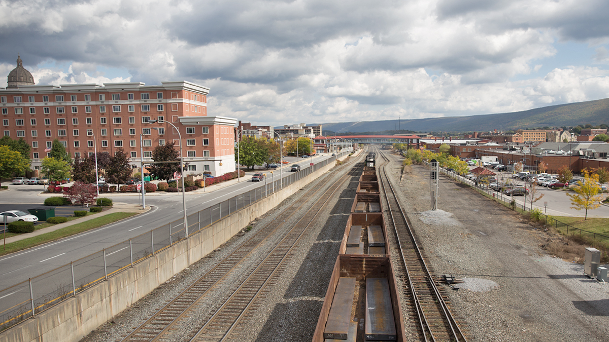 A cargo train passes through downtown Altoona