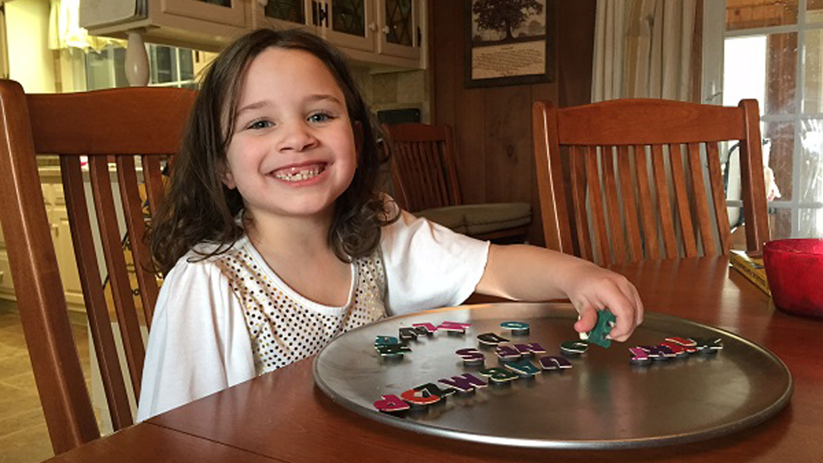  Anna Myers plays at the dinning room table. Her mother, Latrisha Bentch, is among a group pushing for the legalization of medical marijuana.(Mary Wilson/WHYY) 