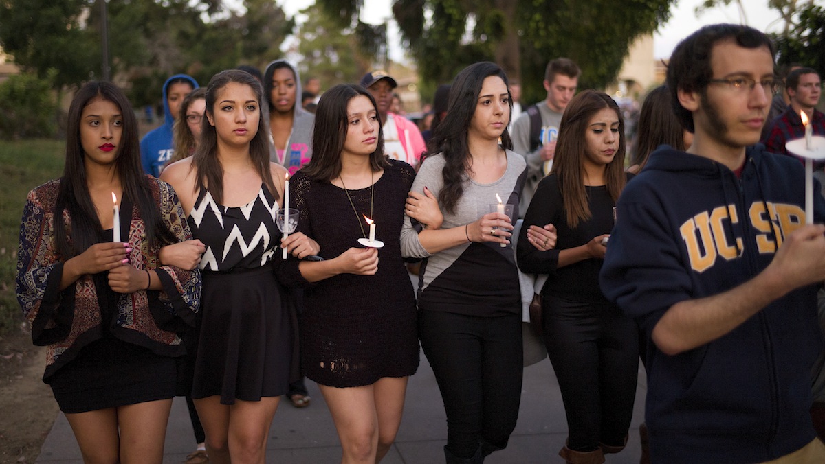  In this May 24, 2014 file photo, students march on the campus of the University of California, Santa Barbara during a candlelight vigil held to honor the six victims of a mass killing in Isla Vista, Calif. Sheriff's officials said Elliot Rodger, 22, went on the rampage near UC Santa Barbara. Accounts of Rodger's hostility to women, and his bitterness over sexual rejection, led to an outpouring of commentary and online debate over the extent of misogyny and male entitlement. (AP Photo/Jae C. Hong, File) 
