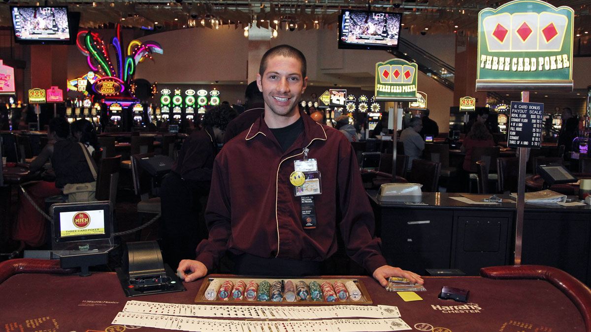  Joe DeFeo waits for patrons at a three-card poker table at Harrah's Casino in Chester. GOP legislative leaders are proposing plans to allow casinos to offer online gaming.(AP file photo) 