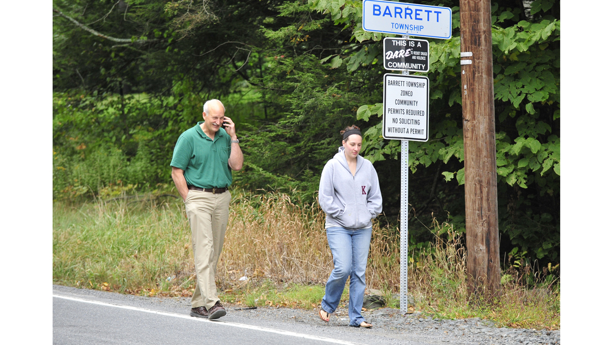Joe Ksiaskiewicz and his daughter Ann Winner walk back to their car after being denied entry by police into the community where they live when police surrounded the area in search of suspected killer Eric Frein last month. As the search continues