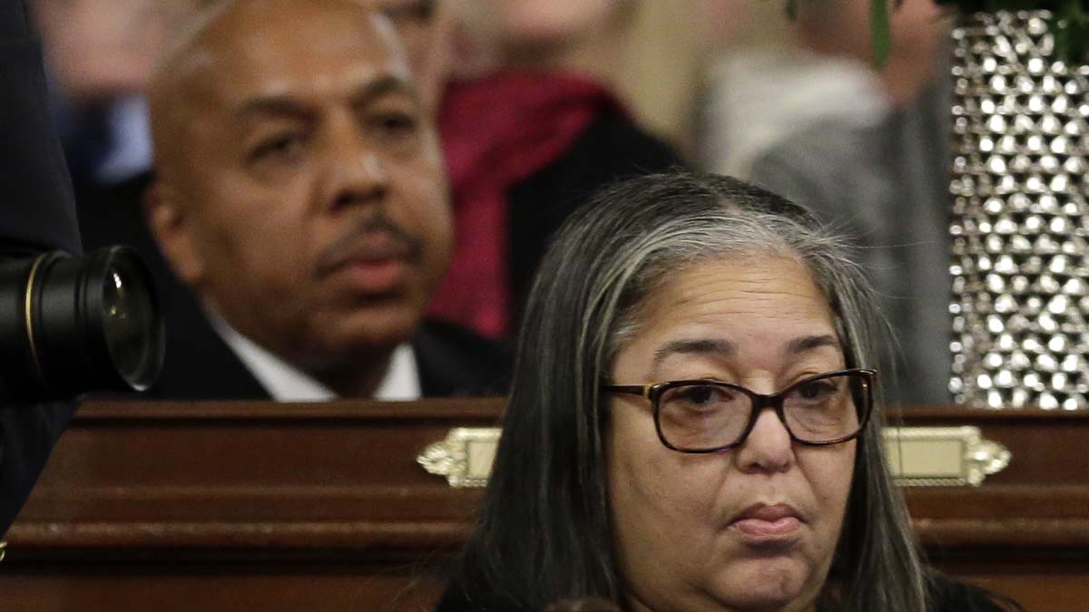  State Rep. Ron Waters, D-Philadelphia, left, and state Rep. Michelle Brownlee, D-Philadelphia, are seen at their desks in January at the state Capitol in Harrisburg. Both have since pleaded guilty in a corruption sting and resigned their seats. They will keep their pensions.(AP file photo) 