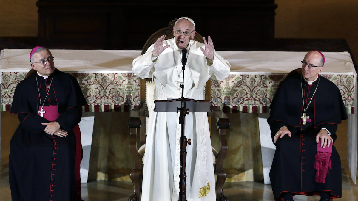  As Archbishop Charles Chaput, left, and Bishop Timothy Senior, right, listens as Pope Francis, addresses a gathering in Saint Martin's Chapel at St. Charles Borromeo Seminary Sunday, Sept. 27, 2015, in Wynnewood, Pa. (AP Photo/Mel Evans) 