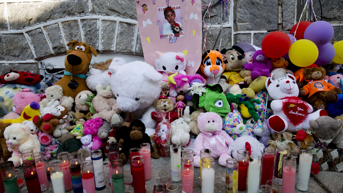  A makeshift memorial is dedicated to  3-year-old Tynirah Borum who was fatally shot in the chest by a stray bullet Aug. 1.(Matt Rourke/AP Photo) 