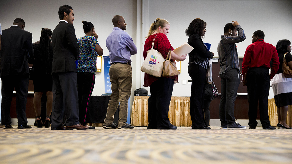 People wait to meet recruiters at a Philadelphia job fair in June 2014. Job preparedness and employment was one of the five areas Governor Wolf’s administration identified that could benefit from Pay for Success performance contracts. (AP Photo/Matt Rourke)