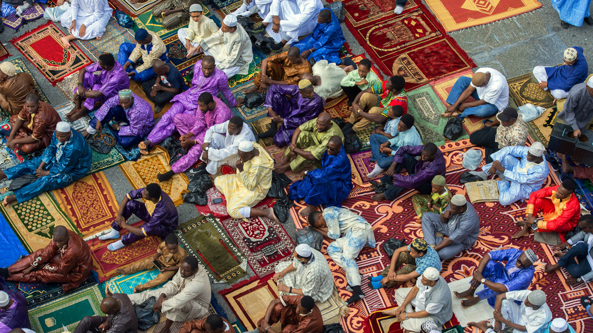 Worshipers in New York's East Harlem neighborhood take part in the traditional annual prayer commemorating Eid al-Fitr