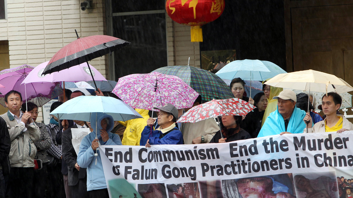  Demonstrators with the organization, End the Persecution of Falun Gong Practitioners in China, protest outside the Chinese consulate in 2012 in Los Angeles. (AP photo) 