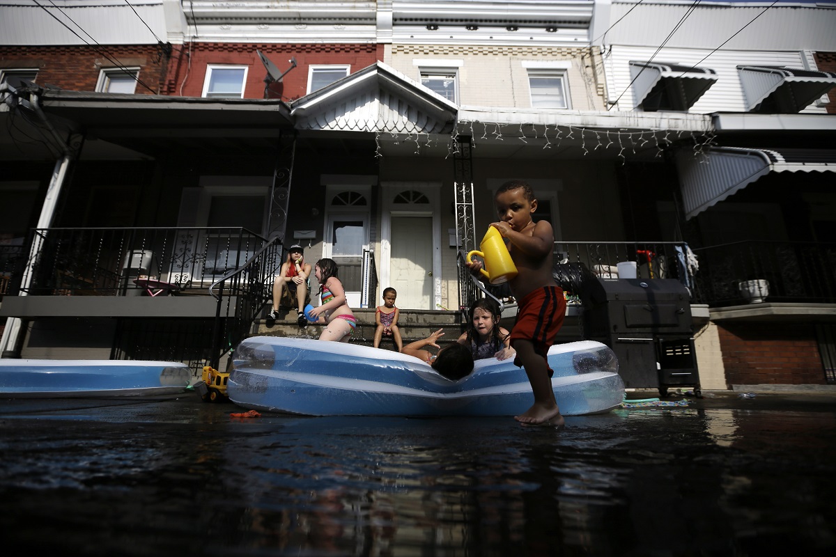  Jayden Jones, from right, 2, Veronica Caines, 6, Aliyah Nguyen, 5, Kianna Roman, 4, and Juliann Esola, 5, cool off in a wade pool under the watch of Amber Escola, of Philadelphia (AP File Photo/Matt Slocum) 
