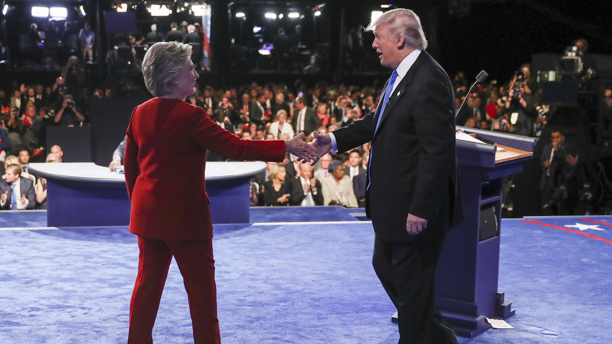 Democratic presidential nominee Hillary Clinton shakes hands with Republican presidential nominee Donald Trump after the presidential debate at Hofstra University in Hempstead