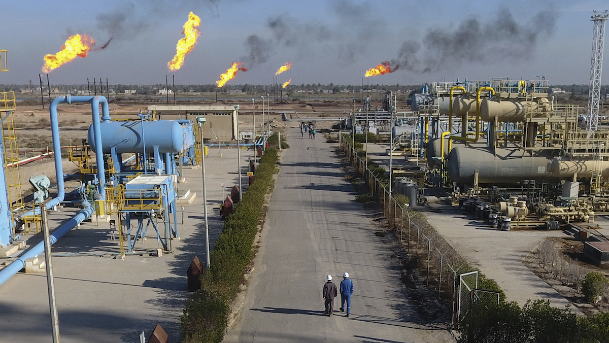 Iraqi laborers work in Nihran Bin Omar field north of Basra