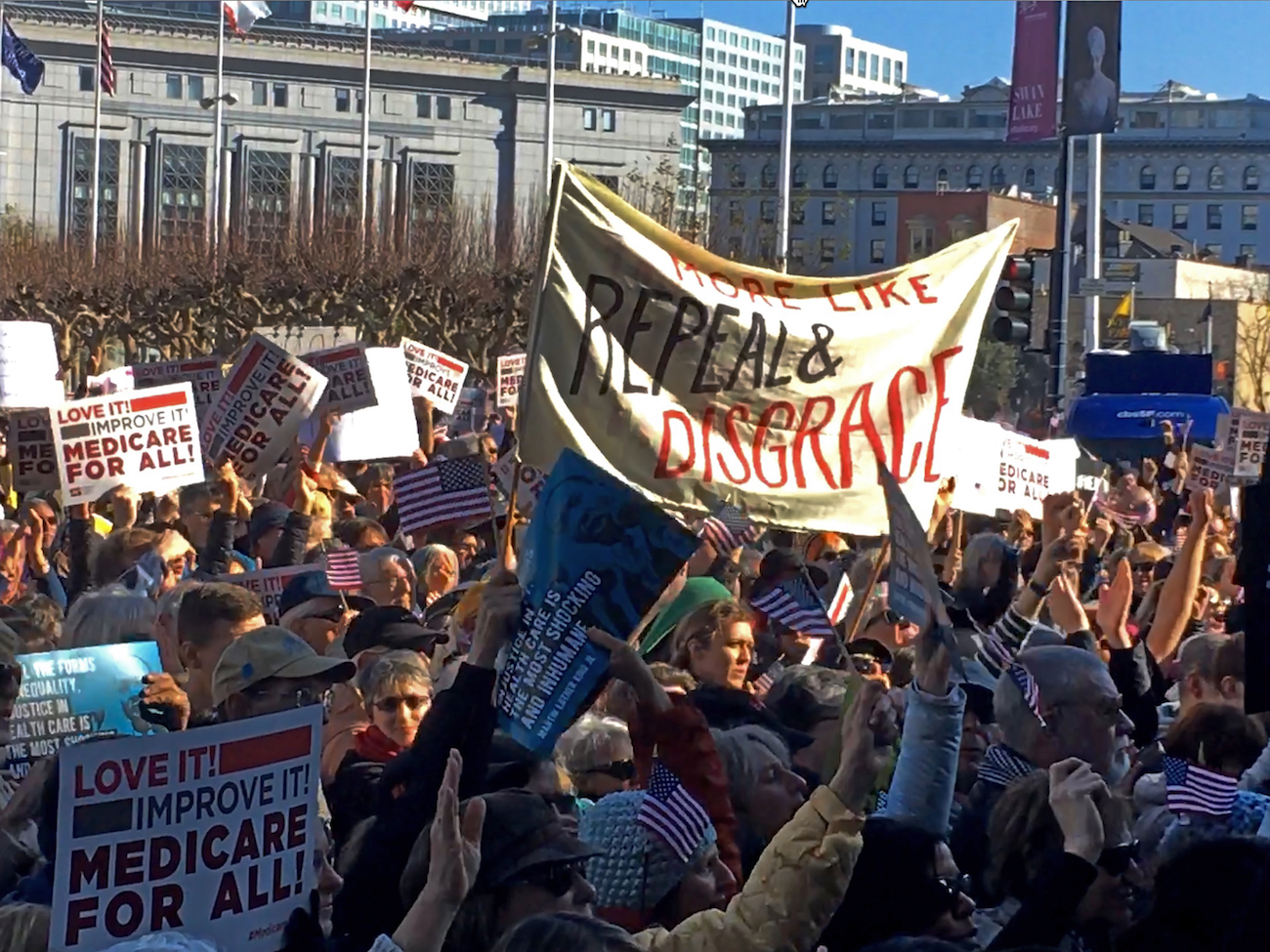 People rally against the dismantling of the Affordable Care Act during a gathering in San Francisco