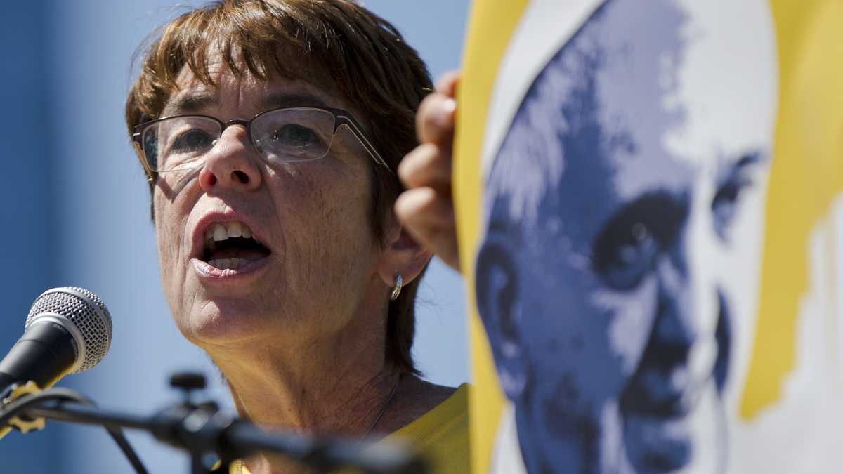 Sister Mary Scullion is seen next to an image of Pope Francis
