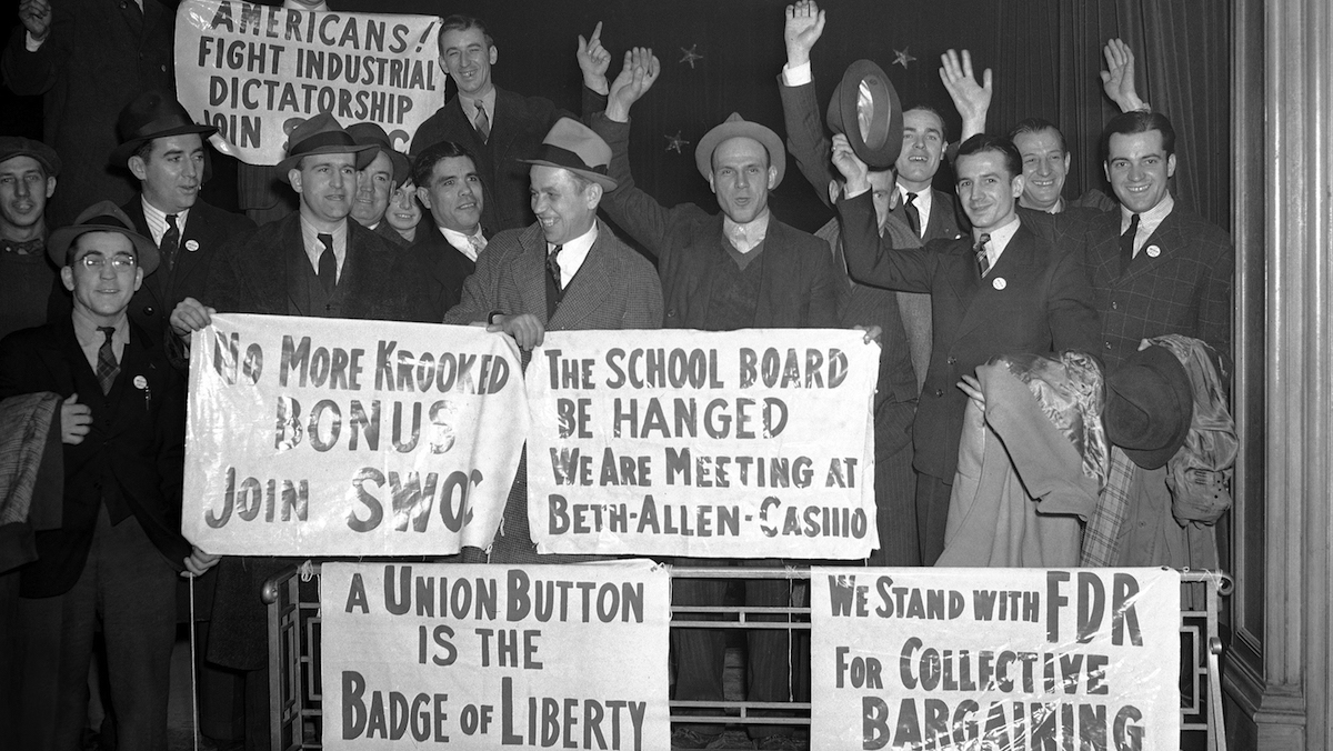 Employes of the Bethlehem Steel Company’s plant display signs they carried at a rally at Bethlehem