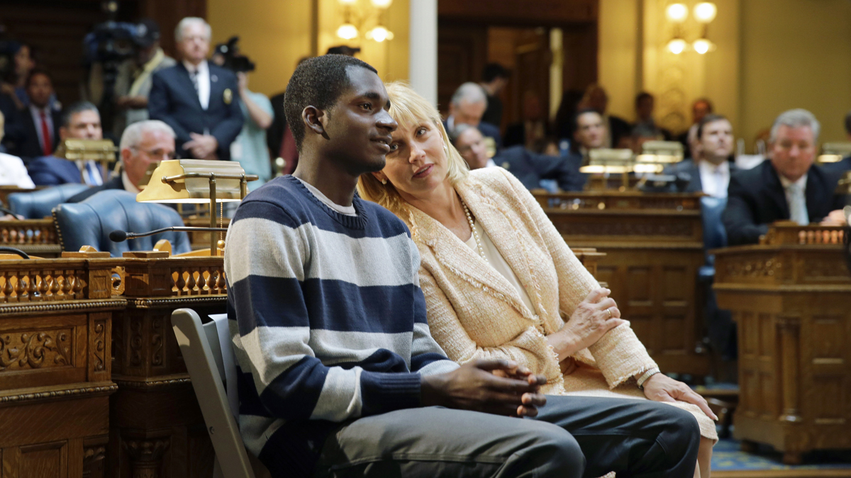 New Jersey Lt. Gov. Kim Guadagno talks with Iquan Small