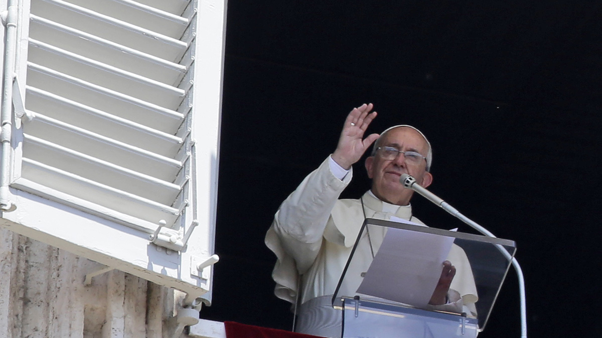  Pope Francis delivers a blessing from his studio's window, in St. Peter's Square at the Vatican Sunday during a heat wave. 