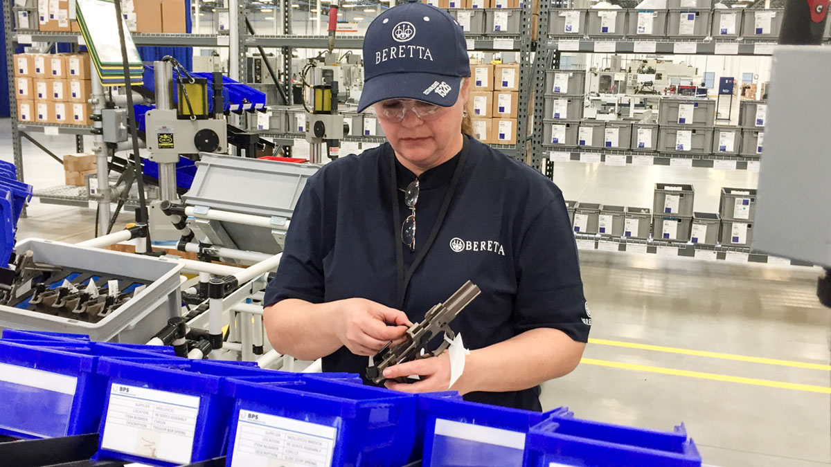A worker assembles a handgun at the new Beretta plant in Gallatin