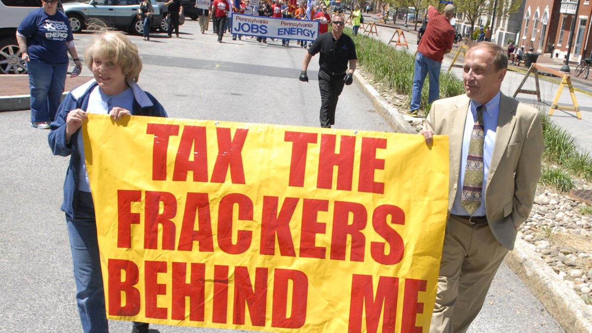  Gene Stilp, right, marches ahead of the Members of the Marcellus Shale Coalition headed for a rally on the steps of the Pennsylvania state Capitol last year. The activist says he will file suit against the state Senate to force besieged state Attorney General Kathleen Kane out of office. (AP file photo) 