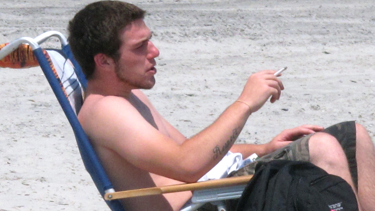 Smokers who violate New Jersey bans on lighting up in a public place are now subject to criminal prosecution. (Wayne Parry/AP Photo)