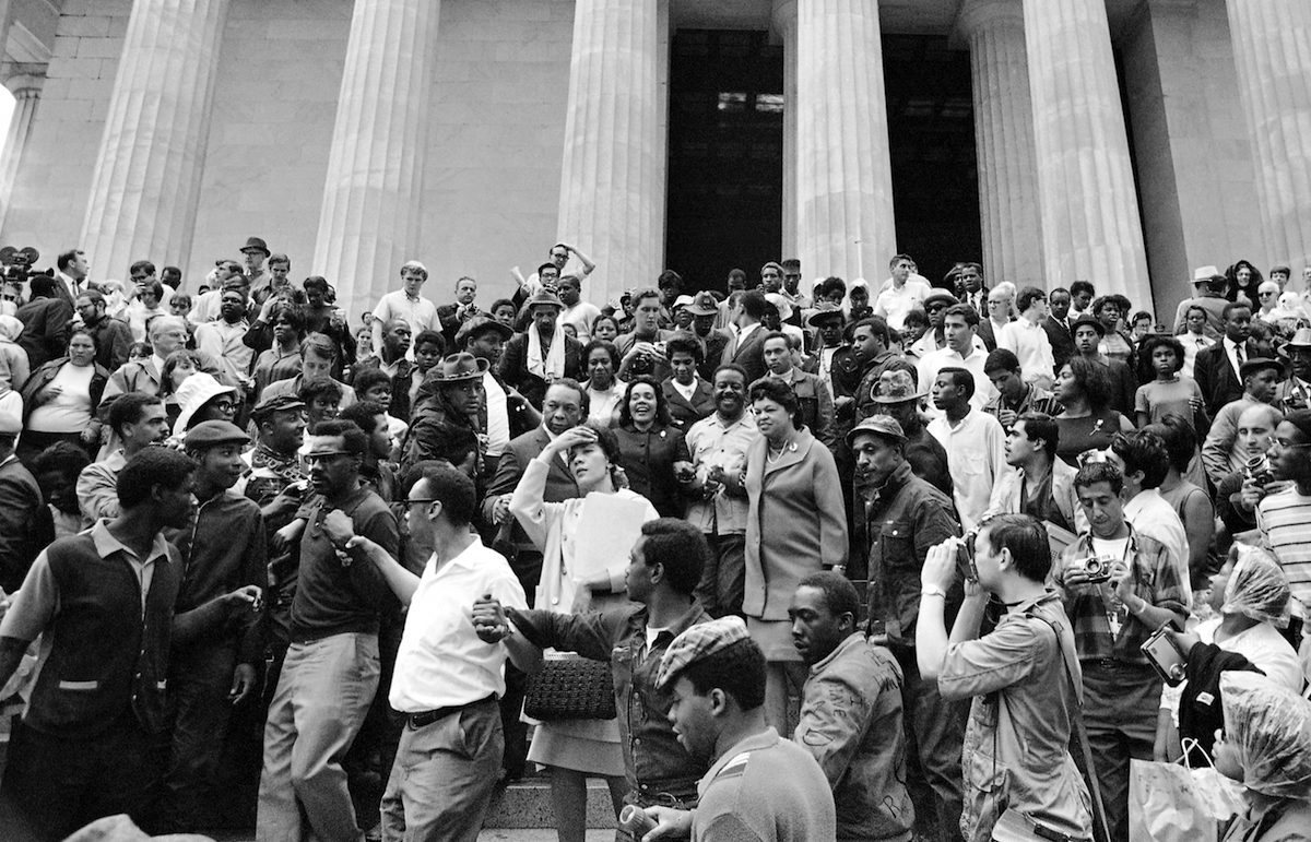  Coretta Scott King, center, is surrounded by members of the Poor People's Campaign, on the steps of the Lincoln Memorial in Washington, May 30, 1968. (AP Photo/Bob Schutz) 