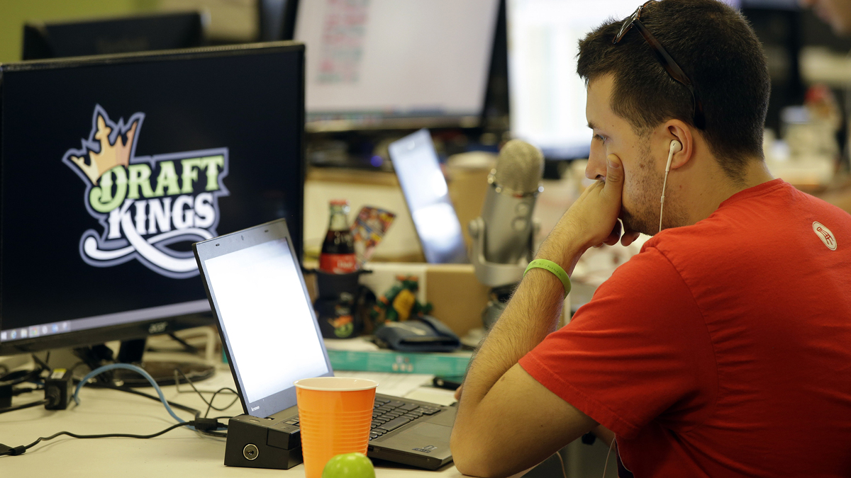  Devlin D'Zmura, a tending news manager at DraftKings, a daily fantasy sports company, works on his laptop at the company's offices in Boston. New Jersey lawmakers are trying to determine if DraftKings and other fantasy sports operations are games of skill or chance -- and whether they should be regulated. (AP photo/Stephan Savoia) 