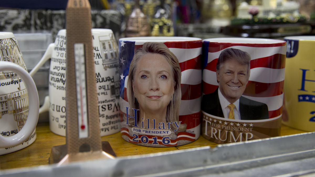 Coffee mugs for sale with the images of Democratic presidential candidate Hillary Clinton and Republican presidential candidate Donald Trump sit side by side on a shelf of a souvenir stand in Washington