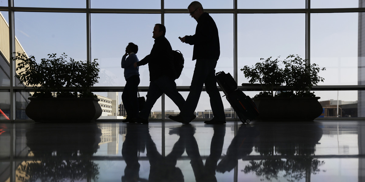 Travelers pass through a corridor at Philadelphia International Airport. (AP file photo) 