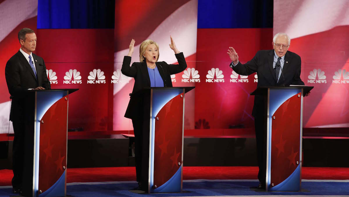  Democratic presidential candidate, Sen. Bernie Sanders, I-Vt, answers a question as Democratic presidential candidate, Hillary Clinton gestures, during the NBC, YouTube Democratic presidential debate at the Gaillard Center, Sunday, Jan. 17, 2016, in Charleston, S.C. Democratic presidential candidate, former Maryland Gov. Martin O'Malley is at left, (AP Photo/Mic Smith) 