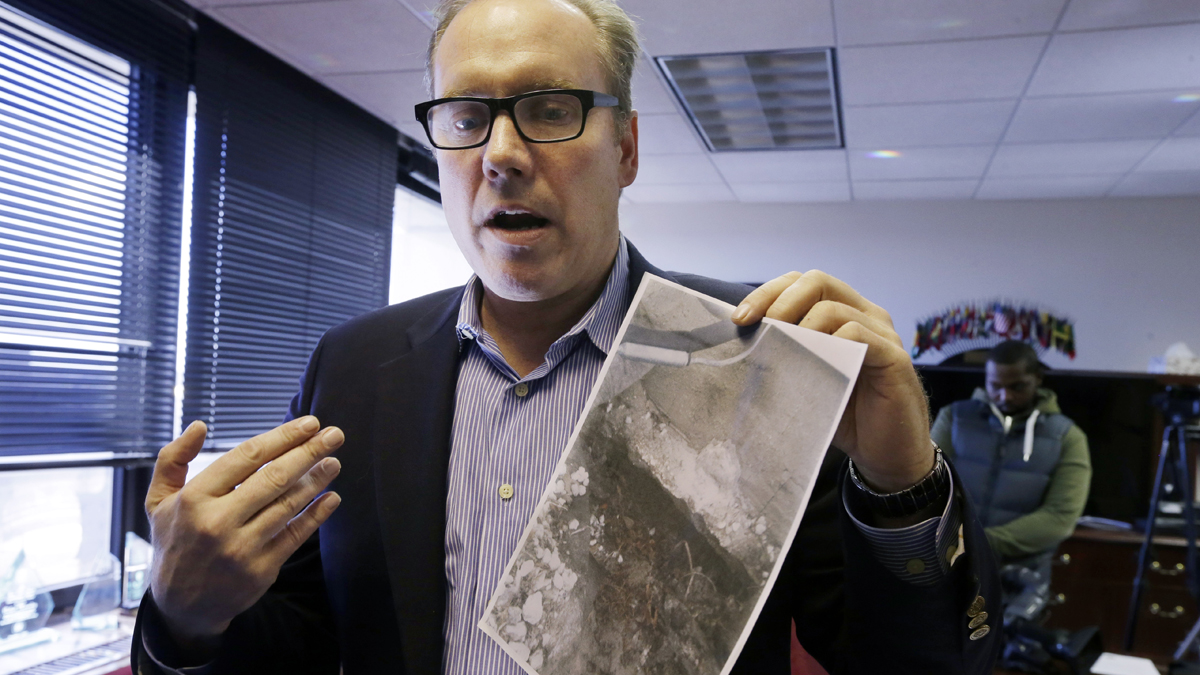  Last year, Douglas Quinn of Toms River, New Jersey, holds a photograph showing damage to his home after Superstorm Sandy. He said his insurance company contended that the damage was pre-existing and refused his claim. Homeowners in a similar situation have until Thursday to request a FEMA review of claims that have been turned down. (AP file photo) 