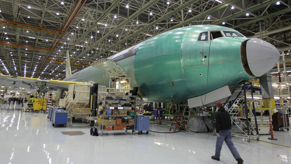 Employees cheer during a rally at Boeing Co.'s 767 assembly plant