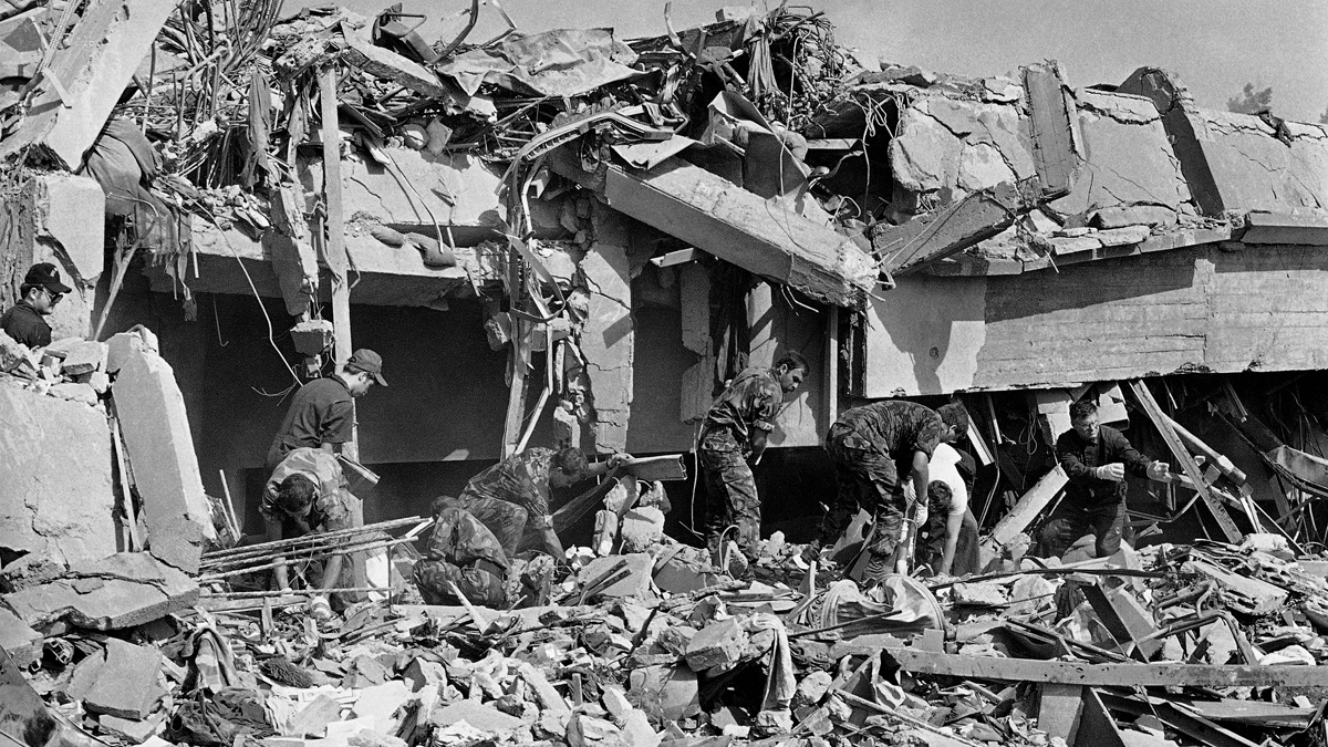  In this Sunday, Oct. 23, 1983, file photo, rescuers prepare to lower a U.S. Marine on a stretcher down to safety below, in Beirut, Lebanon, following a truck bomb attack on the Marine barracks near the Beirut airport. The blast _ the single deadliest attack on U.S. forces abroad since World War II _ claimed the lives of 241 American service members. (Bill Foley/AP Photo, file) 