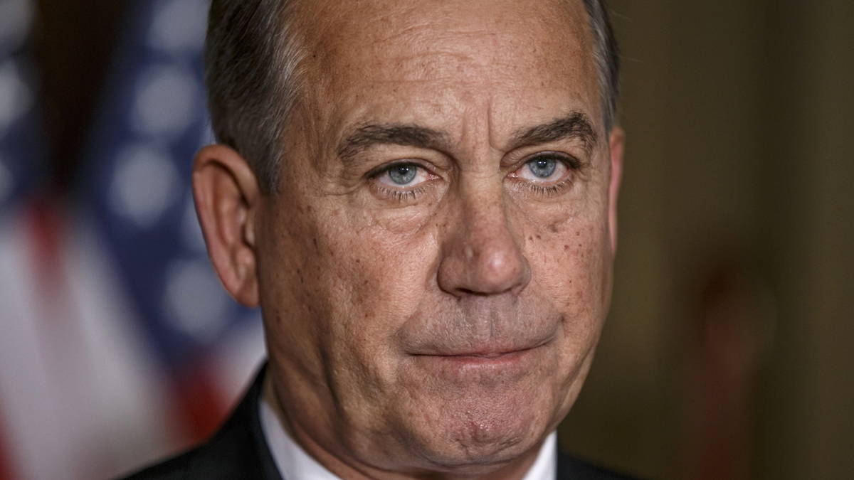  House Speaker John Boehner of Ohio responds to President Barack Obama's intention to spare millions of illegal immigrants from being deported, a use of executive powers that is setting up a fight with Republicans in Congress over the limits of presidential powers, Friday, Nov. 21, 2014, during a news conference on Capitol Hill in Washington. Boehner, who has refused to have his members vote on broad immigration legislation passed by the Senate last year, said earlier that Obama's decision to go it alone 'cemented his legacy of lawlessness and squandered what little credibility he had left.' (J. Scott Applewhite/AP Photo) 