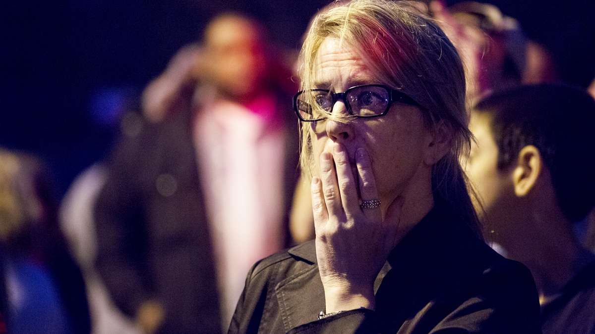  A neighbor stands outside near her home after she heard the sound of shots fired in Watertown, Mass., Friday, April 19, 2013, as a massive search continued for one of two suspects in the Boston Marathon bombings. (Craig Ruttle/AP Photo, file) 