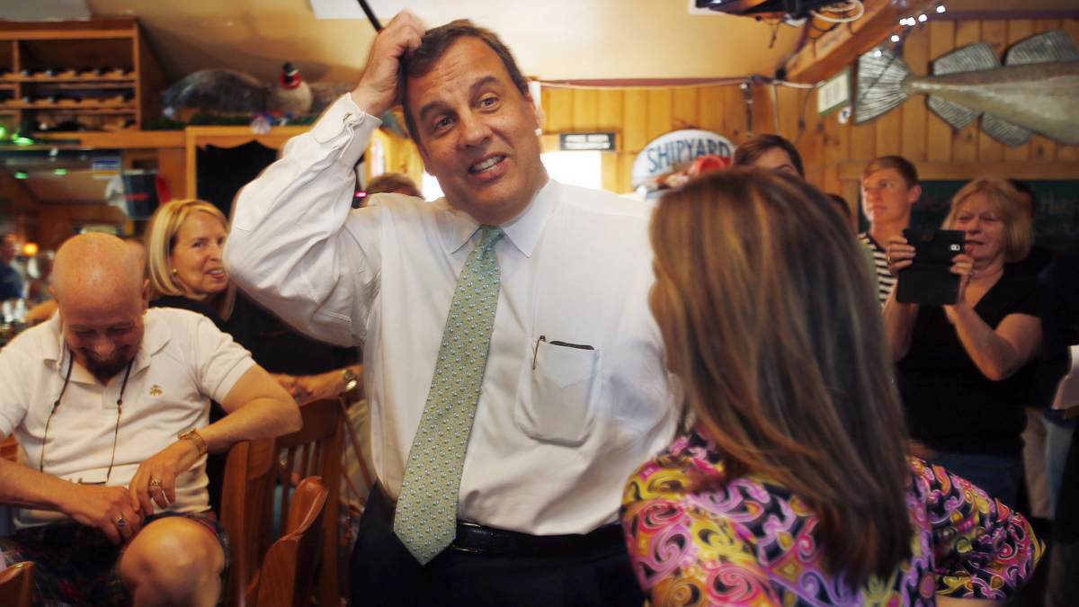 Possible 2016 presidential candidate Republican New Jersey Gov. Chris Christie scratches his head as he talks to patrons of the One Mile West restaurant Thursday in Sunapee