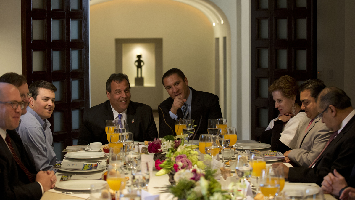  New Jersey Gov. Chris Christie, accompanied by his son Andrew, (left), talks with Puebla Gov. Rafael Moreno Valle, (center right), during breakfast at the governor's residence in Puebla, Mexico, Friday, Sept. 5, 2014. (Rebecca Blackwell/AP Photo) 