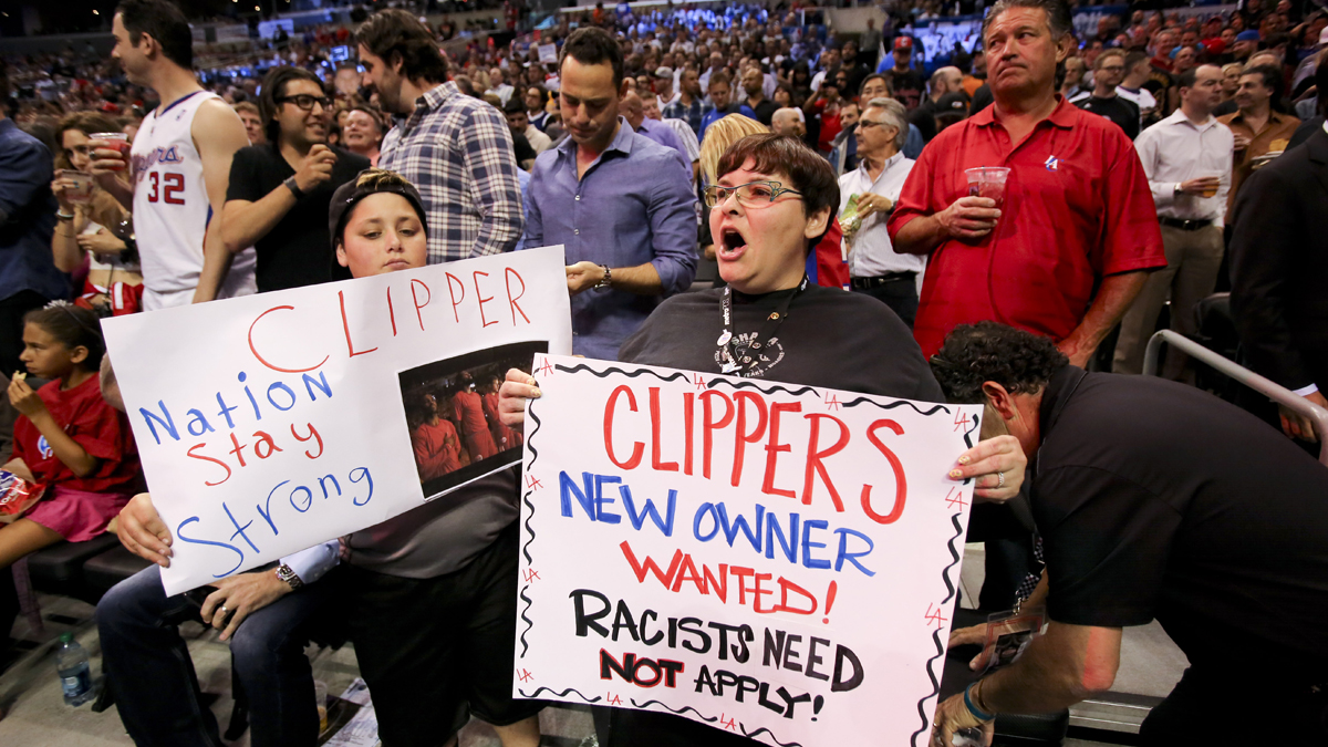  Fans hold up signs in support of the Los Angeles Clippers before Game 5 of an opening-round NBA basketball playoff series between the Clippers and the Golden State Warriors on Tuesday, April 29, 2014, in Los Angeles. NBA Commissioner Adam Silver announced Tuesday that Clippers owner Donald Sterling has been banned for life by the league. (Ringo H.W. Chiu/AP Photo) 