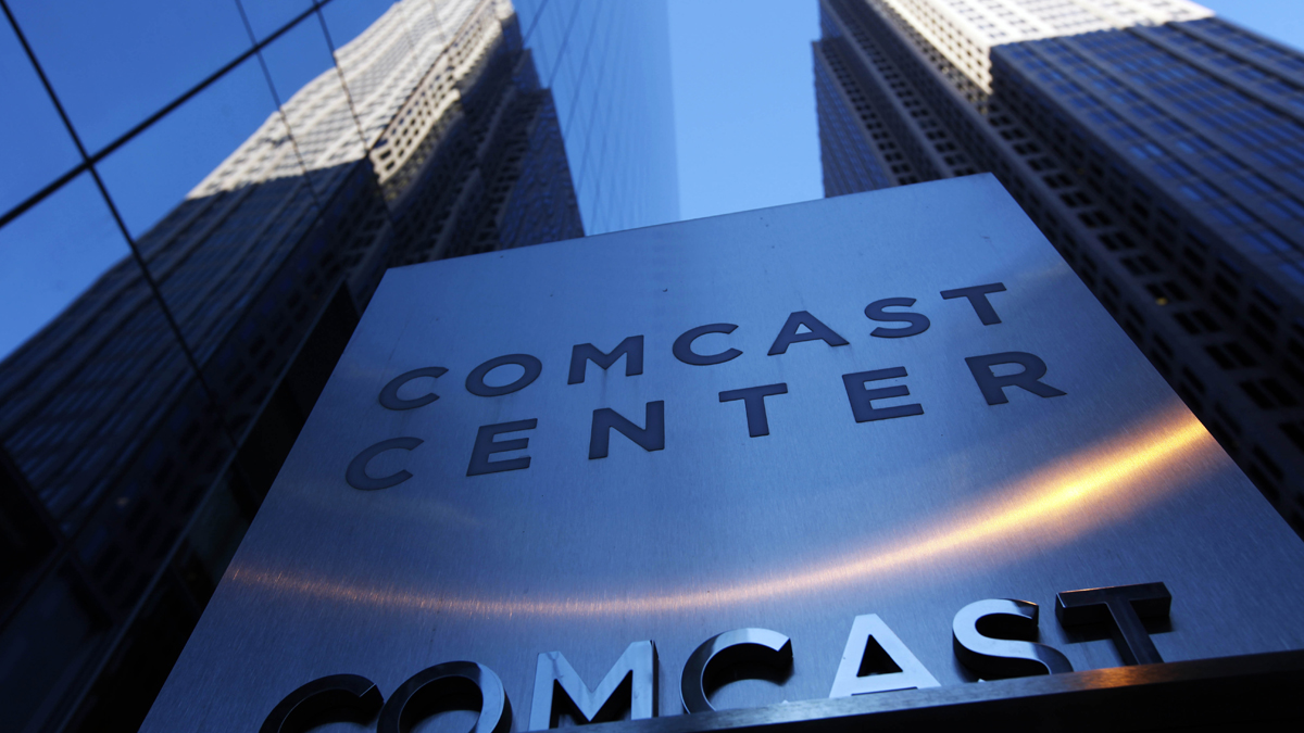  In this Dec. 3, 2009, photo, a sign outside the Comcast Center, left, is shown in Philadelphia. (Matt Rourke/AP Photo, file) 