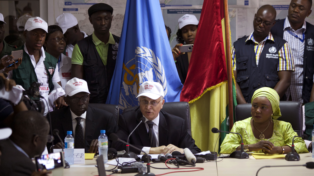  Mohamed Belhocine (center), a representative from the World Health Organization,  speaks during a press briefing in Conakry, Guinea, last month. Guinea has been declared free from transmission of Ebola, the World Health Organization said Tuesday, marking a milestone for the West African country where the original Ebola chain of transmission began two years ago leading to the largest epidemic in history. (Youssouf Bah/AP Photo) 