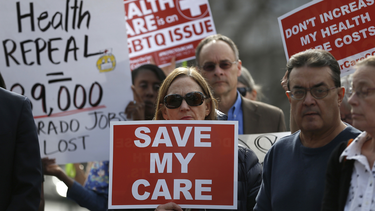 Supporters of the Affordable Care Act who are also opponents of Colorado's GOP-led plan to undo Colorado's state-run insurance exchange gather for a rally organized by the national Save My Care Bus Tour