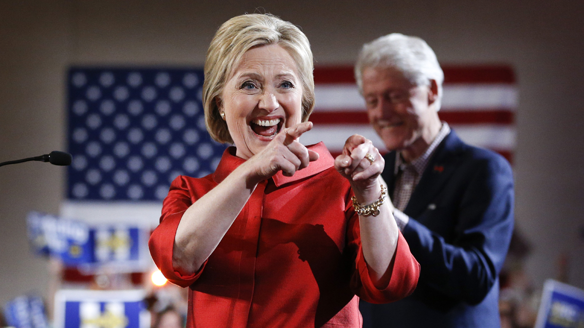 Democratic presidential candidate Hillary Clinton greets supporters with her husband and former President Bill Clinton at a Nevada Democratic caucus rally