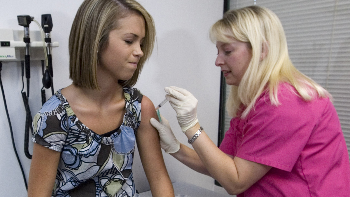  In this Dec. 18, 2007 file photo, a patient winces as she has her third and final application of the Human Papillomavirus (HPV) vaccine administered by a nurse at a doctor's office (John Amis/AP Photo, File) 