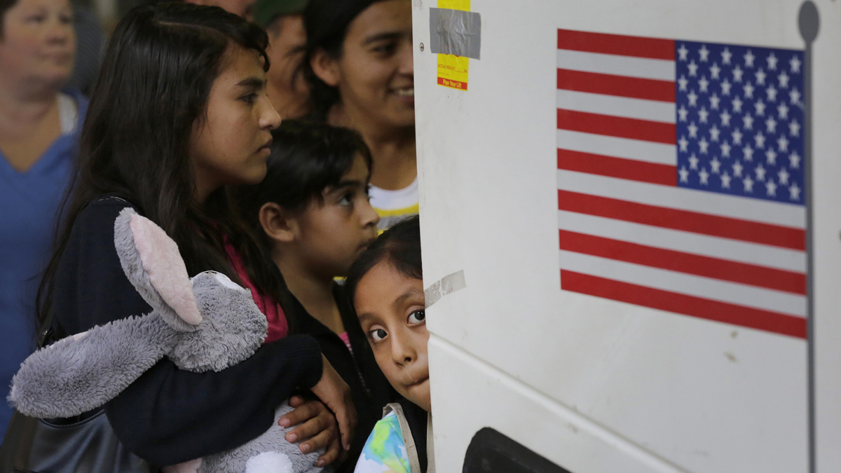  In this July 7, 2015 file photo, immigrants from El Salvador and Guatemala who entered the country illegally board a bus after they were released from a family detention center in San Antonio. A group of immigrant rights lawyers in a filing Thursday, Aug. 13, 2015, say that detention of women and children caught crossing the U.S.-Mexico border illegally is lengthy and unsafe, challenging the government's claims that immigrant families are held only briefly and that their detention doesn't violate a longstanding ban. (Eric Gay/AP Photo, File) 