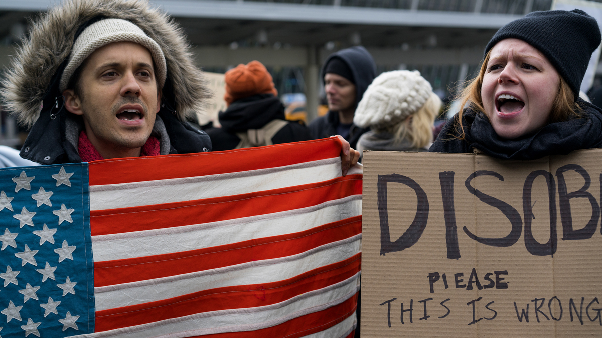 Protesters assemble at John F. Kennedy International Airport in New York, Saturday, Jan. 28, 2017 after two Iraqi refugees were detained while trying to enter the country. On Friday, Jan. 27, President Donald Trump signed an executive order suspending all immigration from countries with terrorism concerns for 90 days. Countries included in the ban are Iraq, Syria, Iran, Sudan, Libya, Somalia and Yemen, which are all Muslim-majority nations. (AP Photo/Craig Ruttle)