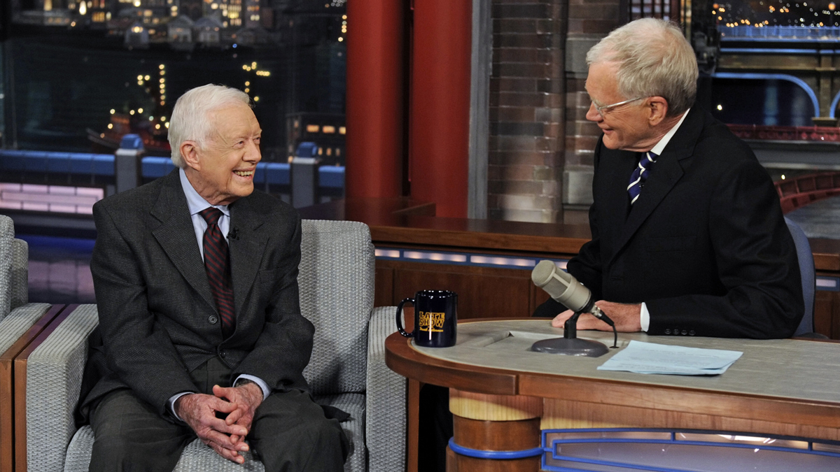  In this photo provided by CBS, former President Jimmy Carter, left, talks with David Letterman on 
